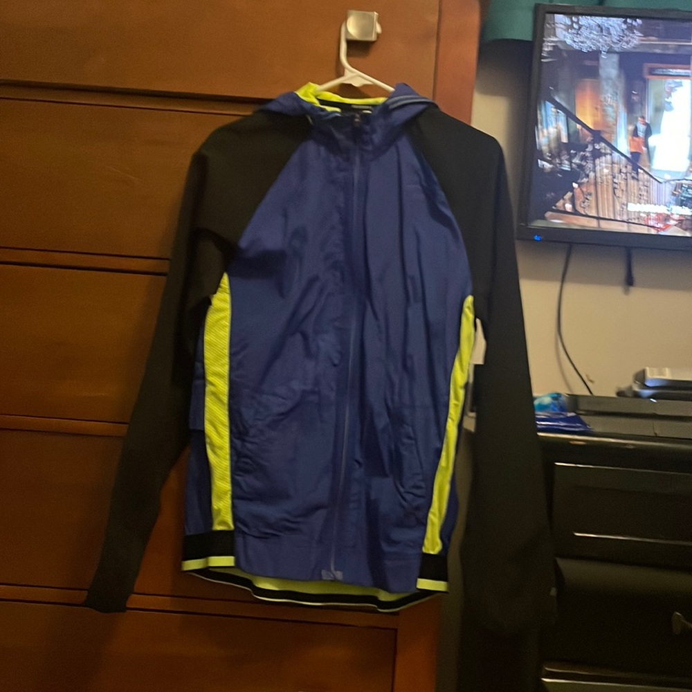 Blue, green and black windbreaker, barely worn